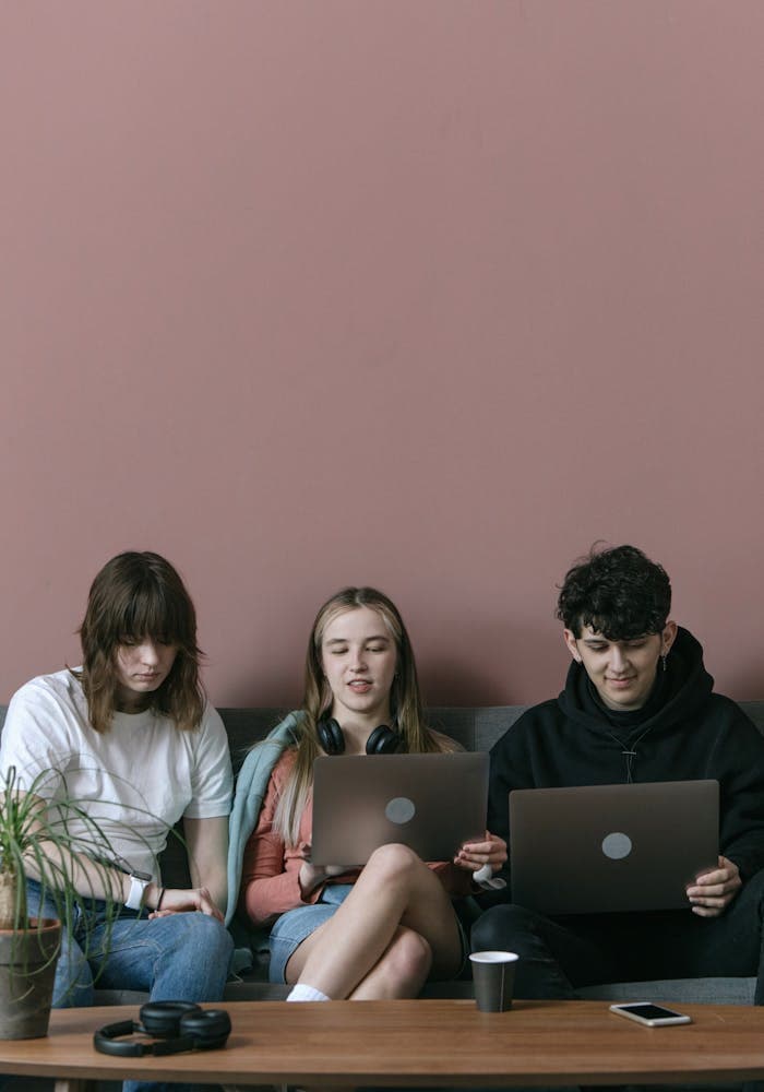Two people working on a laptop together