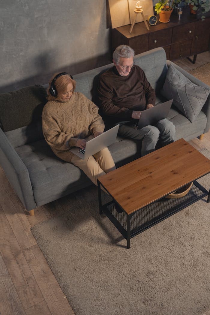 Two people learning together on a couch